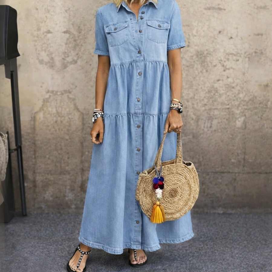 Elizabeth button-front midi dress by The Whitmore Family, featuring a flowing fabric, midi length, and classic button details.