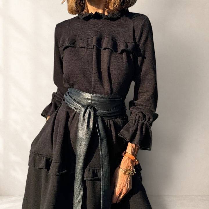 Briannelyse sophisticated midi dress by THE WHITMORE FAMILY, featuring elegant design and sleek fabric, shown on a model.