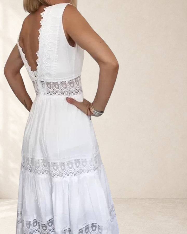 Elegant Alena midi dress by THE WHITMORE FAMILY, shown in a sleek, flowing fabric with a fitted waist and stylish neckline.