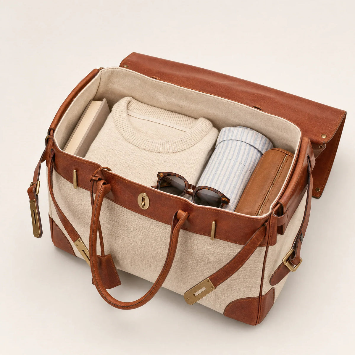 The Eleanor Weekender bag by THE WHITMORE FAMILY, showcasing its spacious design and stylish leather accents.