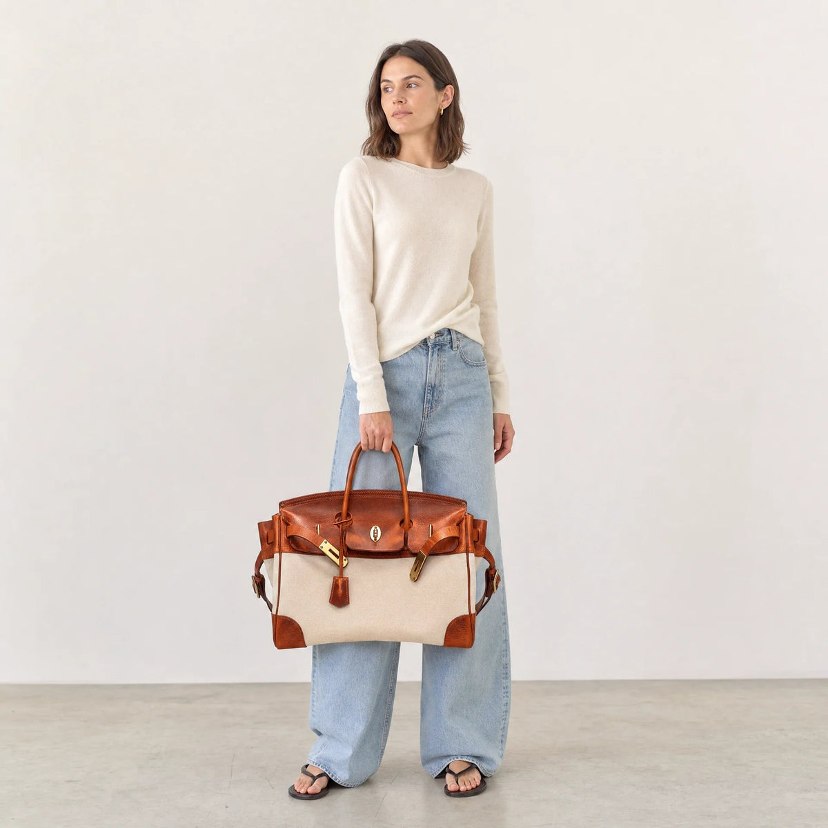 The Eleanor Weekender bag by THE WHITMORE FAMILY shown with its stylish design and spacious interior for travel accessories.