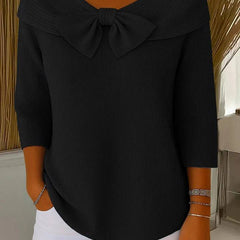 Women's sweater by THE WHITMORE FAMILY featuring a bow detail and round neckline, styled with a cozy knit fabric.
