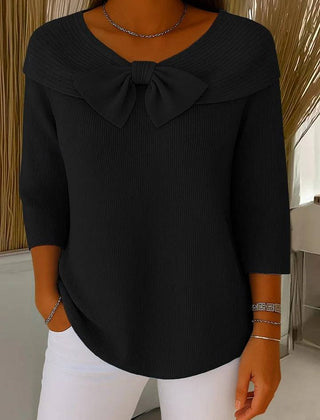 Women's sweater by THE WHITMORE FAMILY featuring a bow detail and round neckline, styled with a cozy knit fabric.