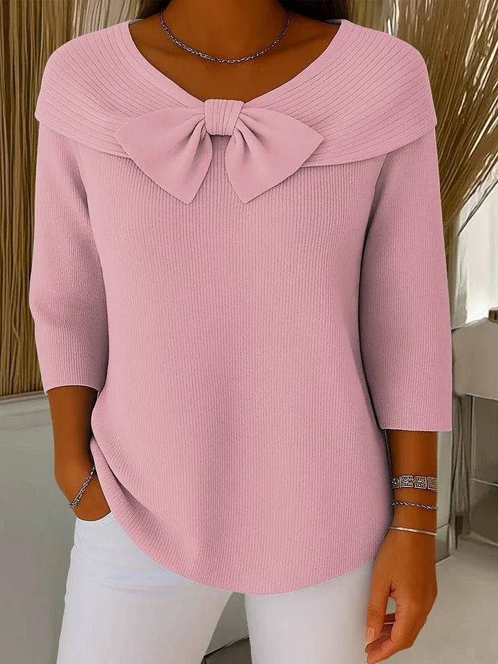 Women’s sweater with bow and round neckline by THE WHITMORE FAMILY, featuring a cozy knit fabric and stylish design.