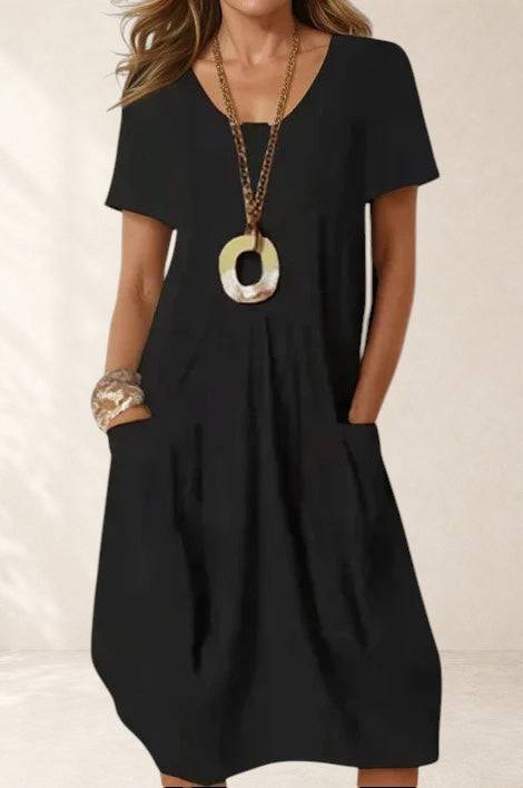 Alani Easy Casual Flow Midi Dress by THE WHITMORE FAMILY, featuring a relaxed fit and stylish design, shown in the image.