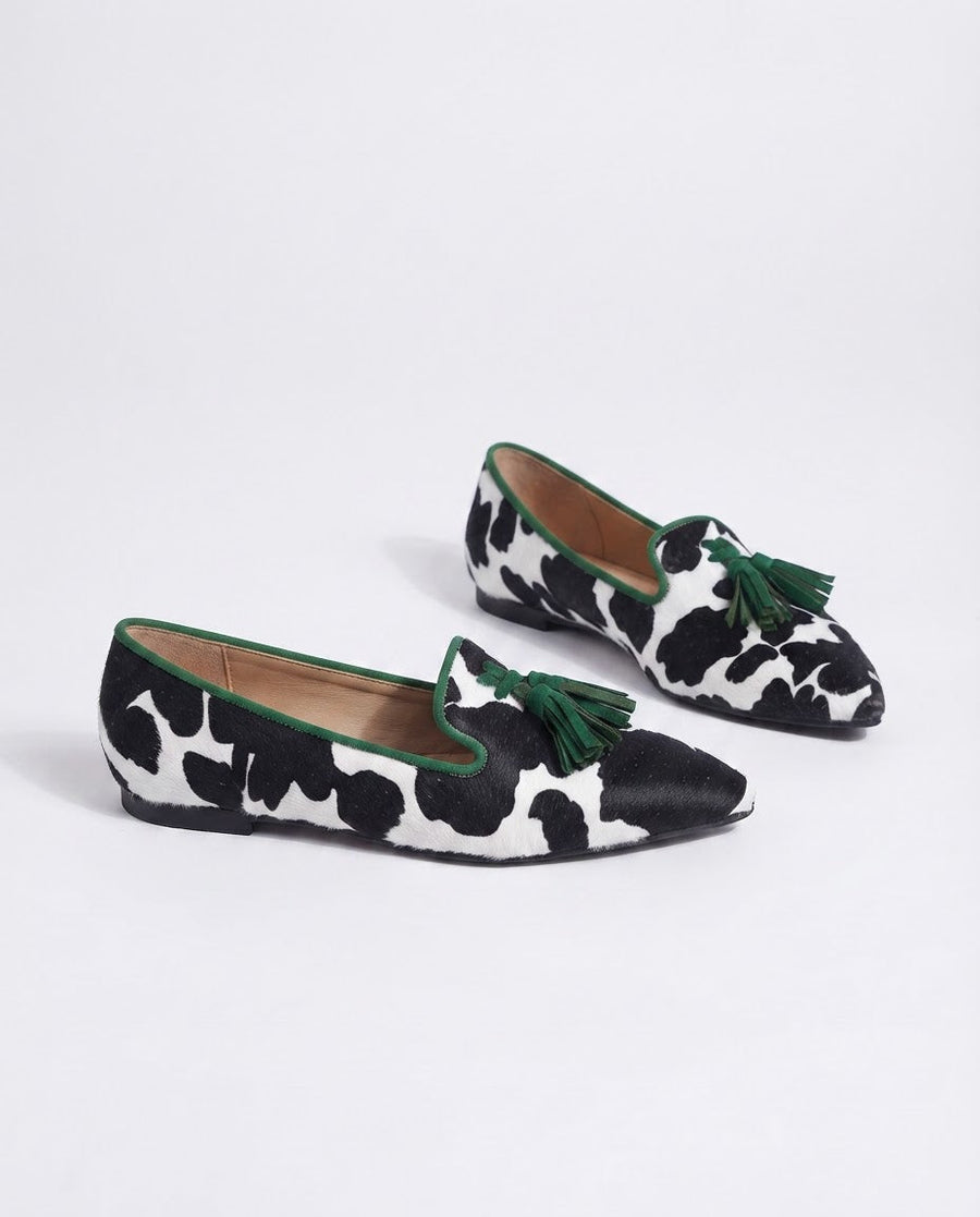 Ginevra Moccasin — Black and White Cow Print, Green Tassels