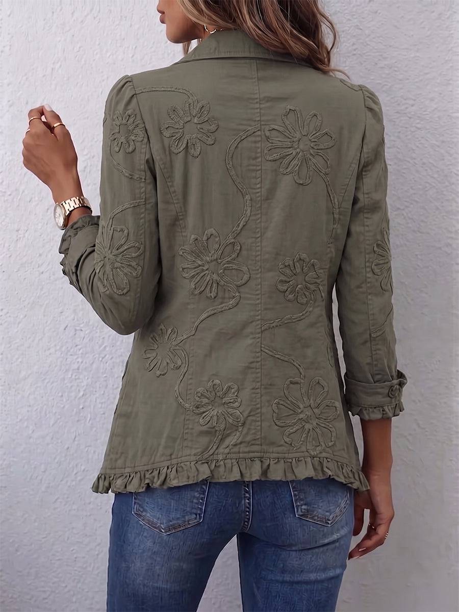Kamberly™ boho-chic floral embroidered utility jacket with ruffled trim, featuring colorful floral embroidery and a relaxed fit.