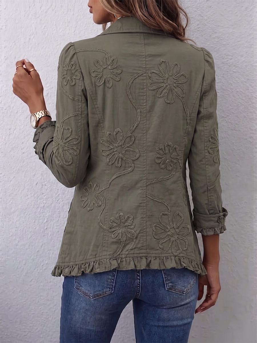 Kamberly™ boho-chic floral embroidered utility jacket with ruffled trim, featuring colorful floral embroidery and a relaxed fit.