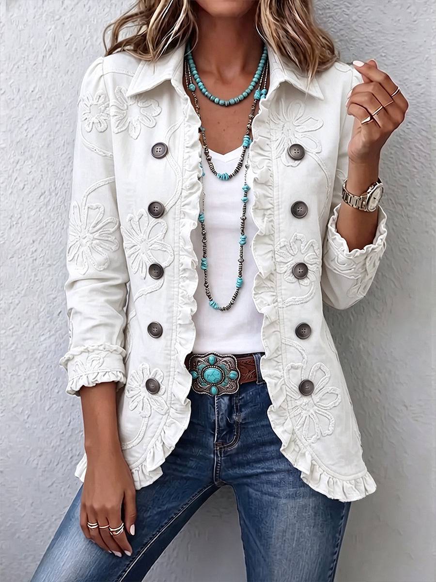 Marisol ivory floral embroidered utility jacket with ruffled trim by THE WHITMORE FAMILY, featuring detailed embroidery and ruffle accents.
