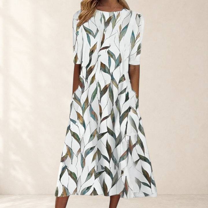 Elegant midi dress named Sarah by THE WHITMORE FAMILY, featuring a fitted silhouette with a stylish neckline.