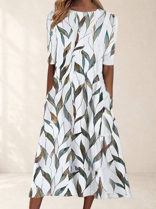 Elegant Karelieth midi dress by THE WHITMORE FAMILY, featuring a sophisticated design with a flowing silhouette and intricate details.