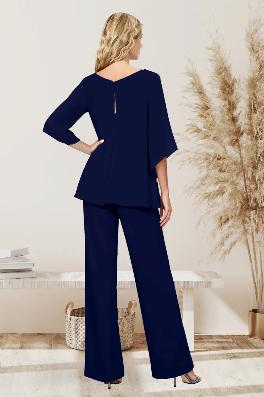 Elegant loose-fit formal pant dress set by THE WHITMORE FAMILY, featuring chiffon fabric and tailored design, shown from the back.