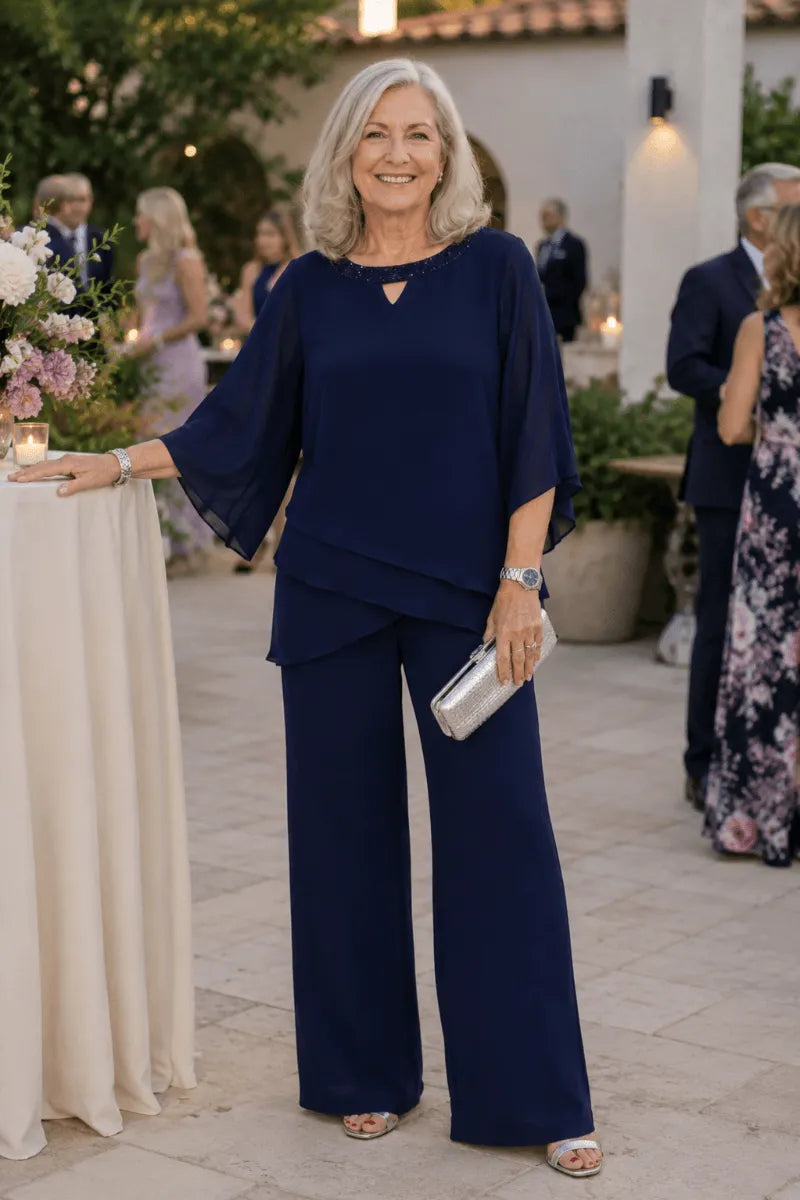 Side view of THE WHITMORE FAMILY sophisticated loose-fit formal pant dress, elegant mother-of-the-bride pant suit for special occasions.