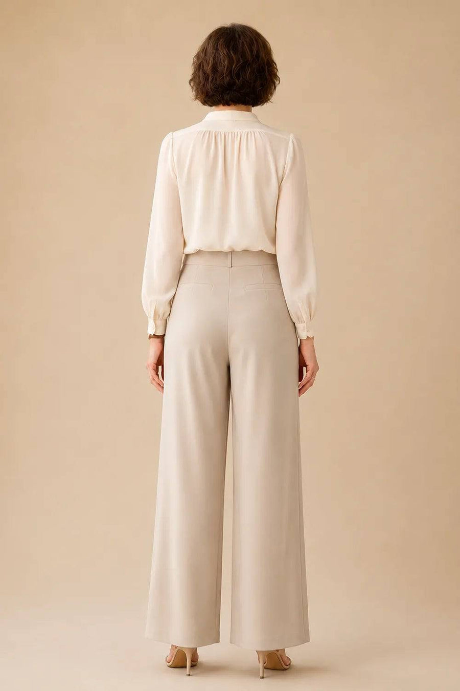 Elegant mother of the bride wide-leg pant suit by THE WHITMORE FAMILY, shown from the back in a stylish dress image.