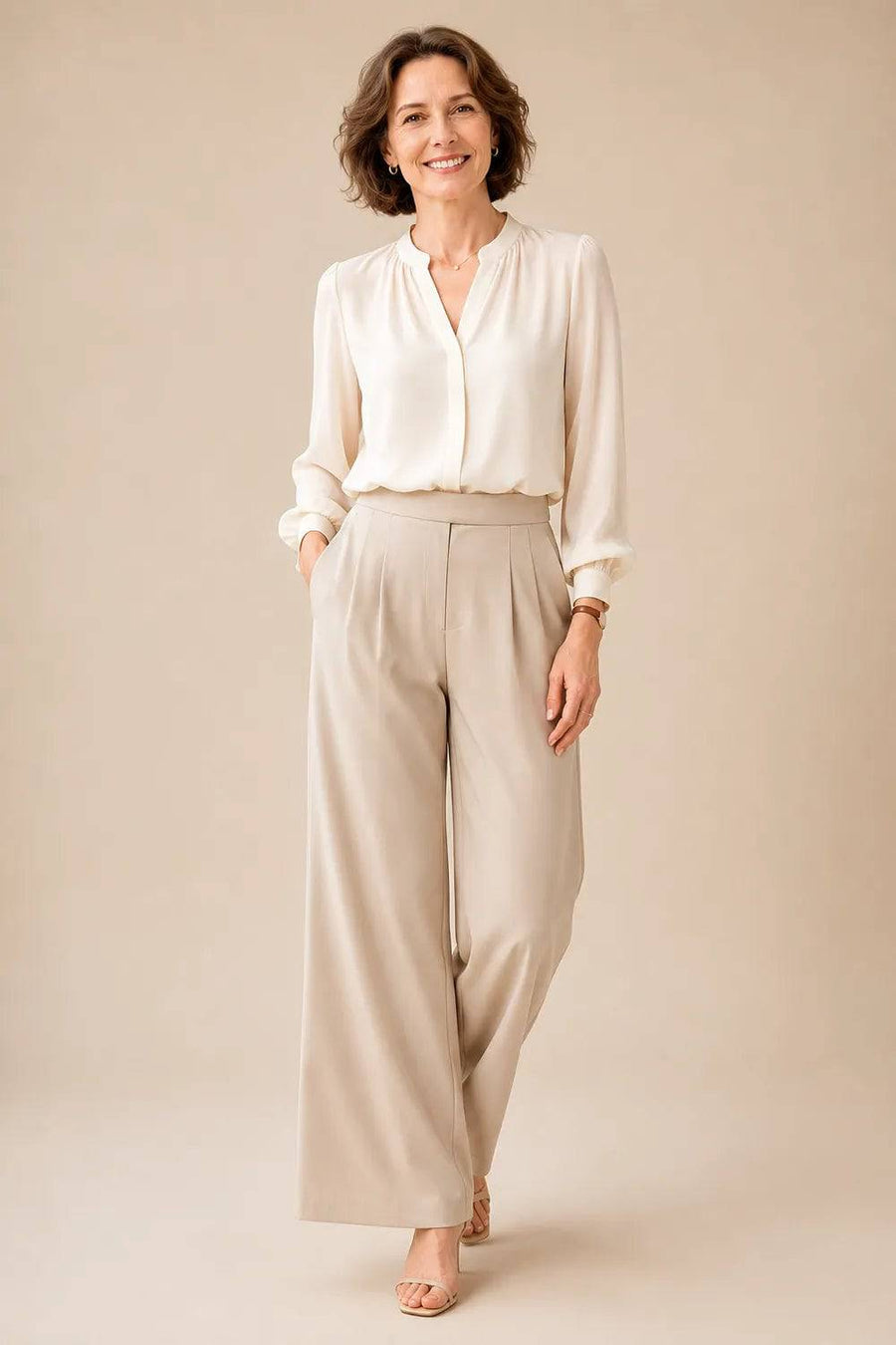Elegant champagne-colored mother of the bride wide-leg pant suit by THE WHITMORE FAMILY, featuring tailored blazer and matching wide-leg trousers.
