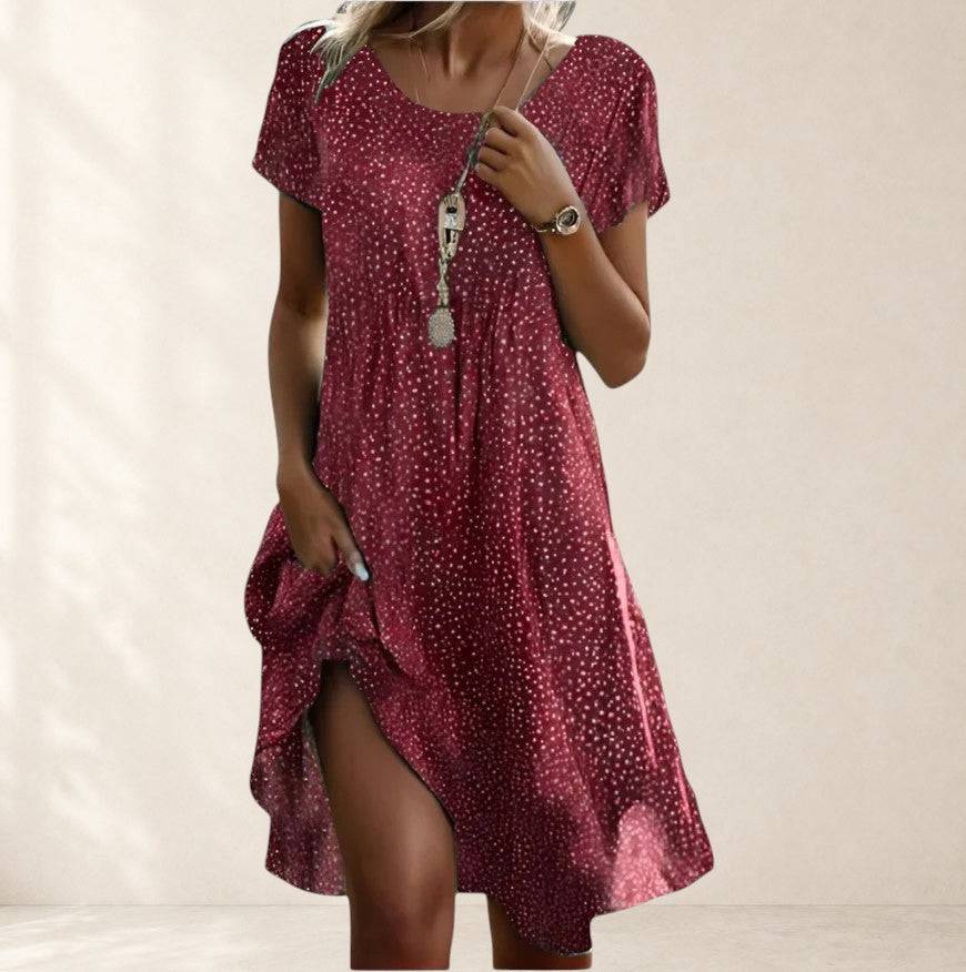 Sienna boho-chic summer dress by THE WHITMORE FAMILY with flowing fabric and earthy tones, perfect for casual warm-weather wear.
