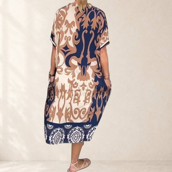 Carvyna comfortable dress by THE WHITMORE FAMILY, featuring a relaxed fit, soft fabric, and stylish design shown on a model.