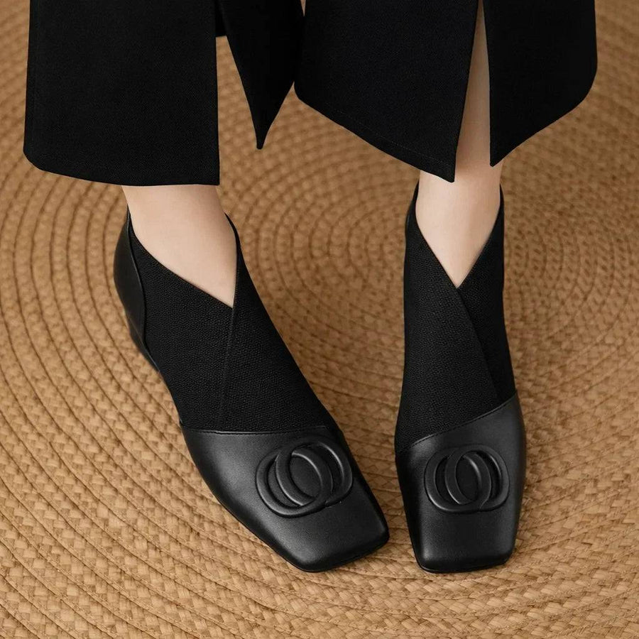 Opium leather boots by THE WHITMORE FAMILY featuring ankle-high design with detailed stitching and sturdy heel.
