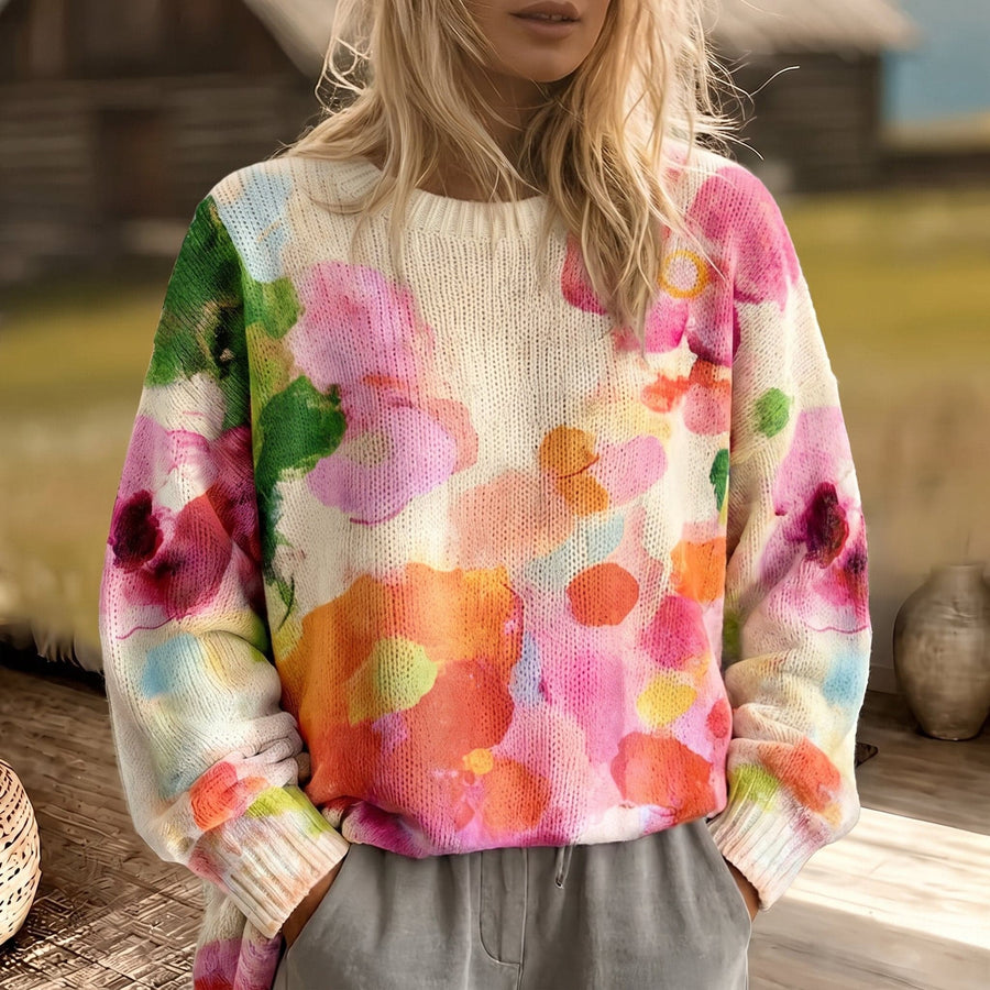 Colorful tie-dye sweater from THE WHITMORE FAMILY, featuring a cozy fit and vibrant pattern, perfect for casual wear.