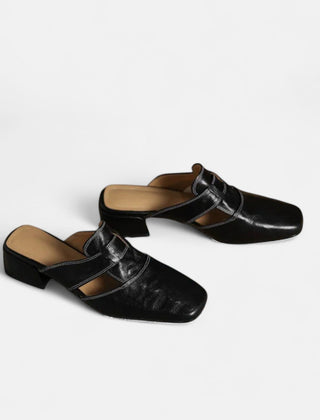 Apricot-colored Andie™ leather sandals by THE WHITMORE FAMILY, featuring elegant straps and a stylish design.