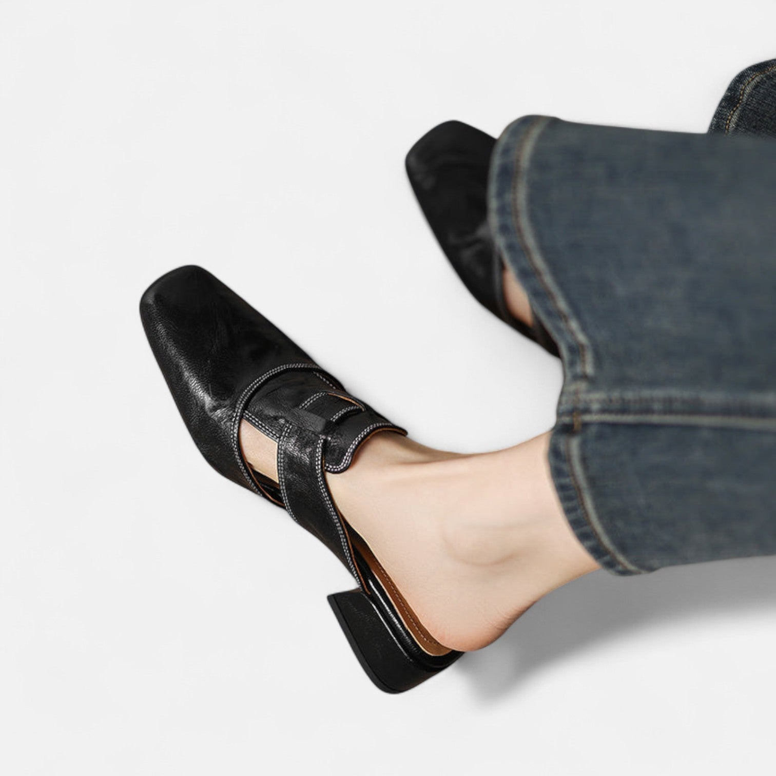 Apricot-colored Andie™ elegant leather sandals by THE WHITMORE FAMILY, showcasing stylish straps and comfortable design.