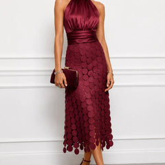 Iréne midi dress by The Whitmore Family featuring a flowy fabric, midi length, and elegant design on a model.