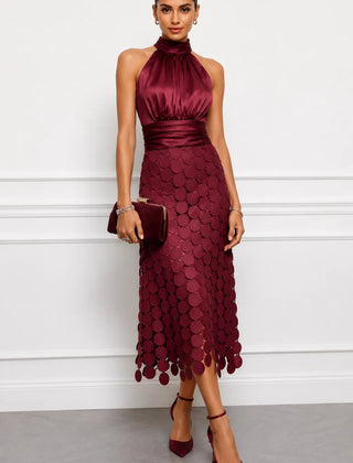 Iréne midi dress by The Whitmore Family featuring a flowy fabric, midi length, and elegant design on a model.