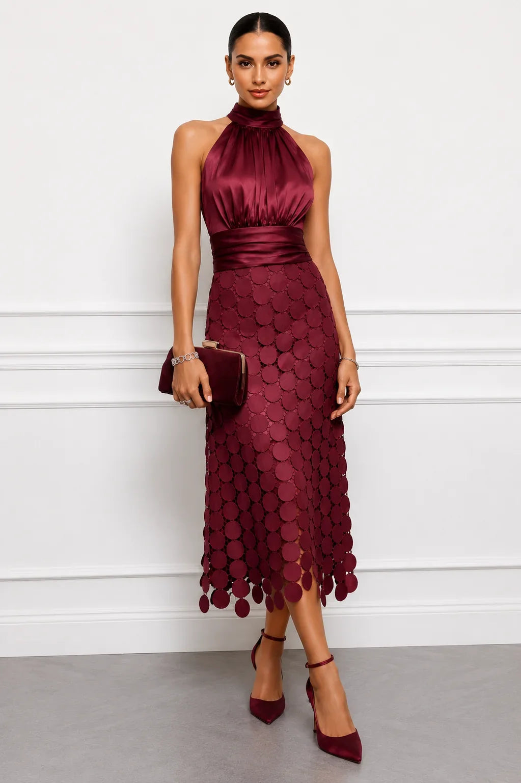 Iréne midi dress by The Whitmore Family featuring a flowy fabric, midi length, and elegant design on a model.