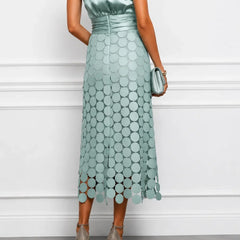 Elegant IRÈNE midi dress by THE WHITMORE FAMILY, featuring a flowy silhouette and stylish design in natural fabric.