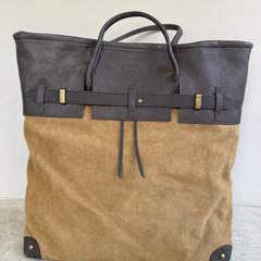 Front view of THE WHITMORE FAMILY Juliette Suede Tote bag with sleek design and sturdy handles.