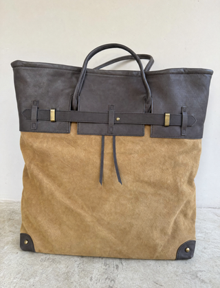 Front view of THE WHITMORE FAMILY Juliette Suede Tote bag with sleek design and sturdy handles.