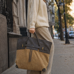 The Juliette Suede Tote bag by THE WHITMORE FAMILY, shown in a lifestyle setting with soft suede material and spacious design.