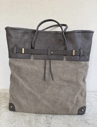 THE WHITMORE FAMILY Juliette Suede Tote bag featuring a sleek front view, soft suede material, and spacious interior.