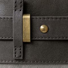 Close-up of The Juliette Suede Tote bag by THE WHITMORE FAMILY, showcasing its textured suede material and elegant design.