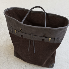 Interior view of THE WHITMORE FAMILY Juliette Suede Tote bag showing spacious main compartment and interior pockets.