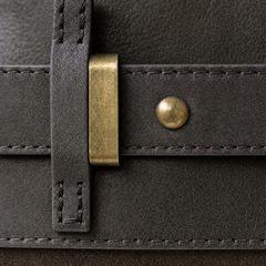 Close-up of THE WHITMORE FAMILY Juliette Suede Tote bag showing textured suede material and sturdy handles.
