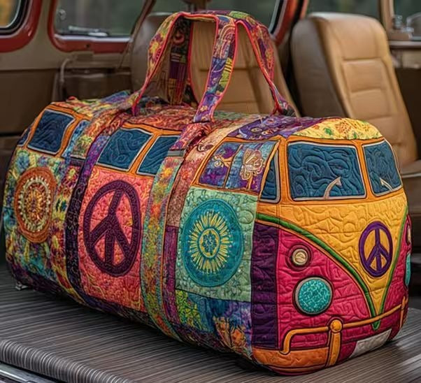Black quilted travel duffle bag by THE WHITMORE FAMILY featuring sturdy handles and spacious design for travel essentials.