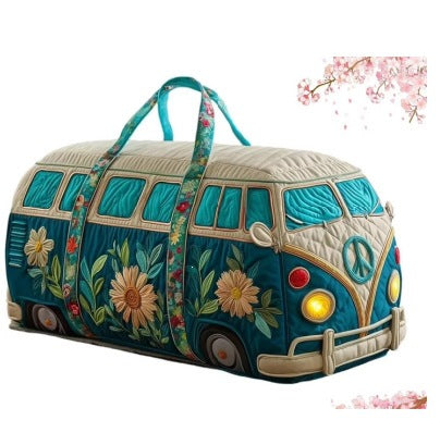 TealVana quilted travel duffle bag by The Whitmore Family, showing its spacious design and sturdy handle for travel.