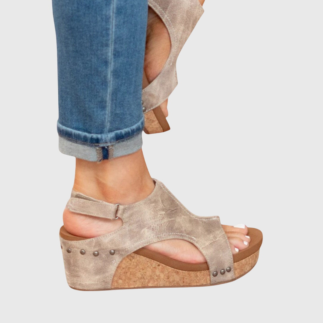 Beige Adela™ orthopedic sandals by THE WHITMORE FAMILY featuring cushioned soles and supportive straps.