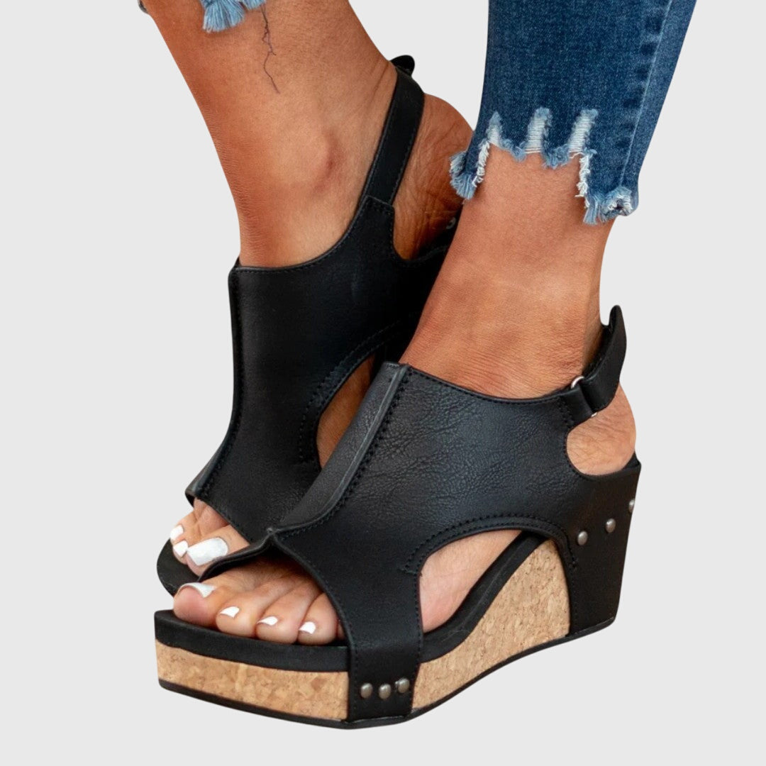 Beige Adela™ orthopedic sandals by THE WHITMORE FAMILY with cushioned soles and supportive straps, designed for comfort.