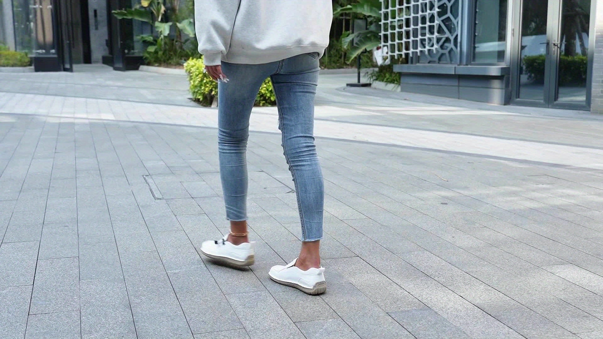Beige Célya™ ergonomic support sneakers by THE WHITMORE FAMILY with cushioned soles and breathable upper for comfortable walking.
