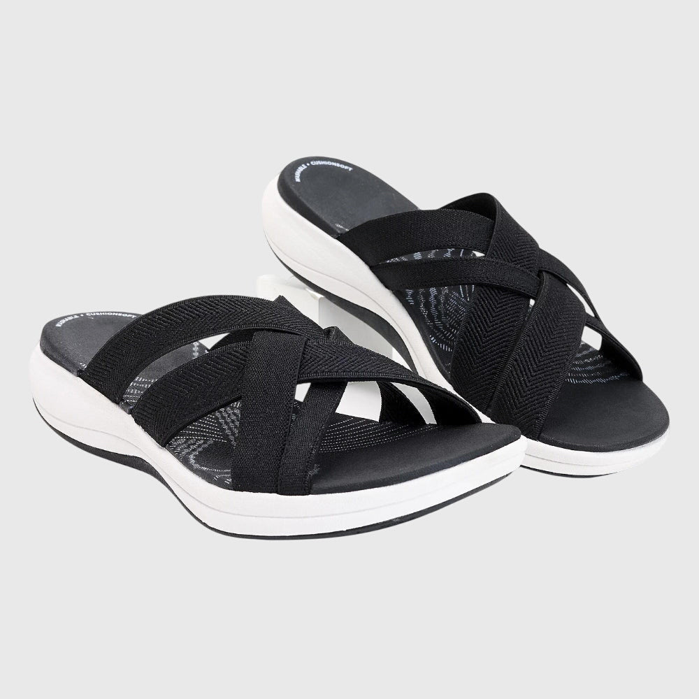 Beige Jade™ orthopedic sandals by THE WHITMORE FAMILY featuring cushioned soles and supportive straps for comfort.