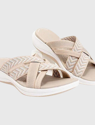 Beige Jade™ orthopedic sandals by THE WHITMORE FAMILY with cushioned soles and adjustable straps, designed for comfort and support.