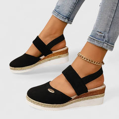 Beige Maylien™ orthopedic sandals by THE WHITMORE FAMILY with cushioned straps and contoured footbed for comfort.