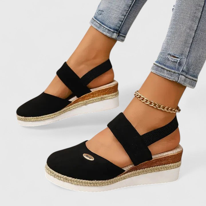 Beige Maylien™ orthopedic sandals by THE WHITMORE FAMILY with cushioned straps and contoured footbed for comfort.