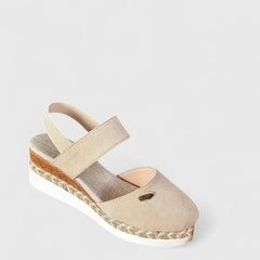 Beige Maylien™ orthopedic sandals by THE WHITMORE FAMILY with cushioned footbed and adjustable straps for comfortable support.