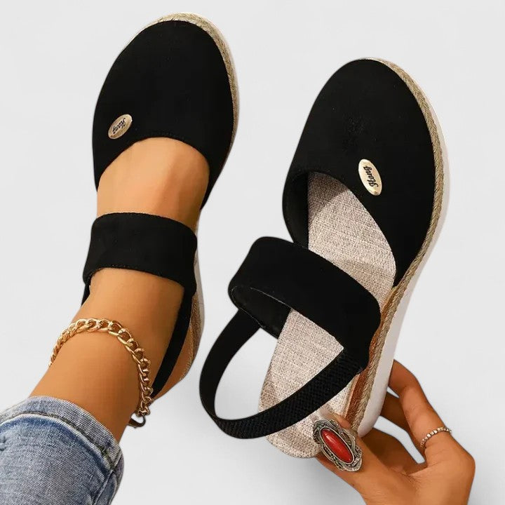 Beige Maylien™ orthopedic sandals by THE WHITMORE FAMILY with cushioned straps and supportive sole for comfortable wear.
