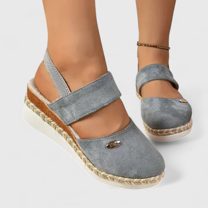 Beige Maylien™ orthopedic sandals by THE WHITMORE FAMILY with adjustable straps and cushioned soles for supportive comfort.