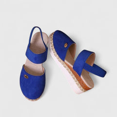 Beige Maylien™ orthopedic sandals by THE WHITMORE FAMILY, featuring cushioned straps and supportive sole for comfortable wear.
