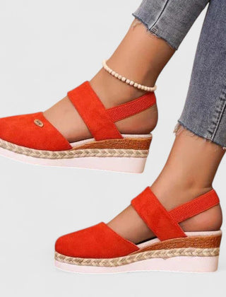 Beige Maylien™ orthopedic sandals by THE WHITMORE FAMILY with cushioned straps and supportive sole, designed for comfort and style.